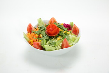 Green salad, tomatoes, cucumbers, carrot, lettuce, lemon, spice