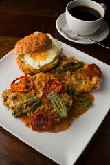Chicken fried steak. Flank steak battered & deep fried in cast iron skillet. Classic American southern, low country cuisine. Made from scratch chicken fried steak served with gravy and side dishes.