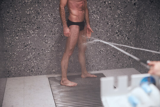Man healing his legs with Charcot douche