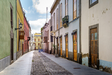 street with old, picturesque and charming houses in bright colors in the city of Las Palmas de Gran Canaria. Canary Islands. Spain.