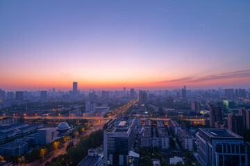 Fototapeta na wymiar Aerial view of the city skyline at dawn.