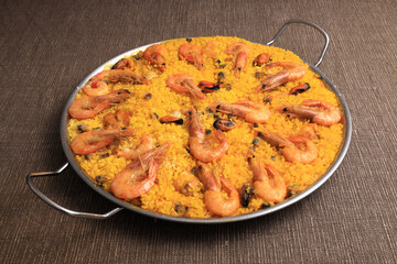 Valencian seafood paella in paellera