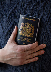 man holding new post Brexit blue British passport Devon, United Kingdom, January, 2021