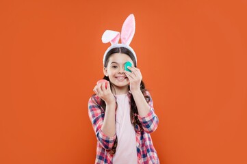 happy easter kid girl wearing ears for bunny hunt in easter holiday hold eggs, egg hunt