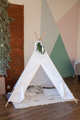 Kid's wigwam in children room. Interior in Scandinavian style. Play corner.  © Юлия Ефимова