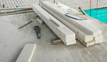 construction saw tool put on cement floor in can at house site. prepare equipment for install wall white brick.
