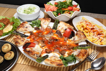 lamb skewer on aubegine puree with butter and tomatoes sauce