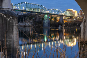 Walnut Street bridge reflecting in the Tennessee River at night.