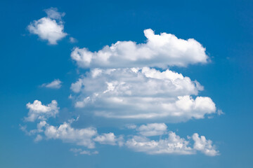 Naklejka na ściany i meble White clouds in the sky in clear weather.