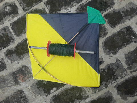 Indian kites and spool used in the very popular sport of kite fighting. These are traditionally used on Makar Sankranti or Independence day