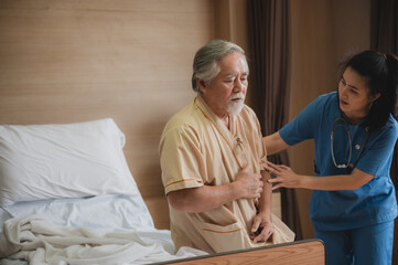 Nurses support the elderly patient man to resting at hospital room, medical health care and old disease  insurance concept