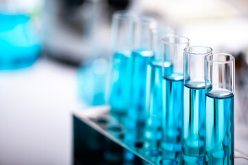 test-tube and laboratory glassware setting for science research, medical study, experiments for researching modern medical innovations, blue liquid sample test