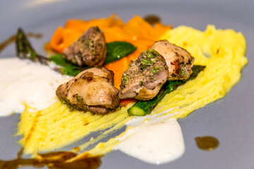 Chicken liver with potato and carrot puree. The food in the restaurant. Food styling and restaurant meal serving.