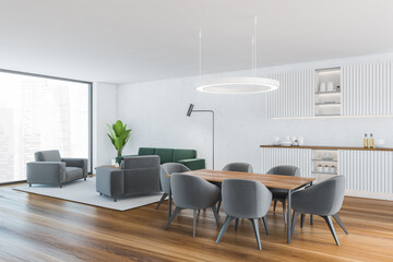 White living room with grey furniture and dining table with chairs