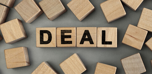deal - word concept from wooden blocks. Top view
