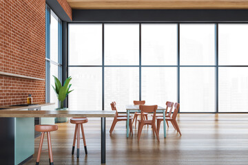 Modern kitchen interior with brick wall, wooden countertops with a built in sink and a cooker. mock up. Loft apartment with dining area.