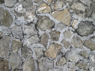 Sandstones embedded in the wall. Modern natural design in construction.