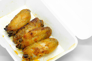 Close-up of Chicken wings in paper box container for take away