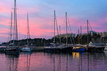 Fototapeta na wymiar Various ships and boats in a marina of Thessaloniki, Greece at sunset