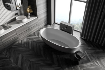 Top view of wooden grey bathroom with white bathtub, sinks near window