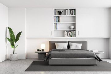 White and grey bedroom, bed with linens and bookshelf