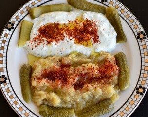 Mezze plate with eggplant and yogurt as appetiser before dinner or with drinks