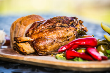 Pork knee with bread, cucumber and side dish. The food in the restaurant. Food styling and...