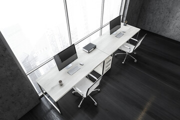 Top view of black business room with computers near window