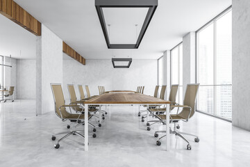 White conference room with furniture near window in business office