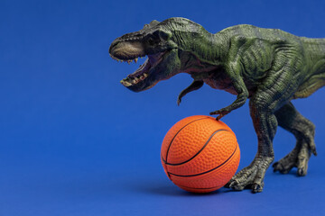 Green dinosaur toy with basketball ball. Basketball minimal card blue background.