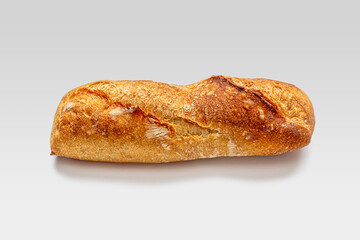 Small mini baguette with slits on a crisp golden crust