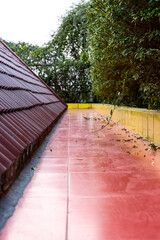 A small walking open space on the rooftop beside the garden