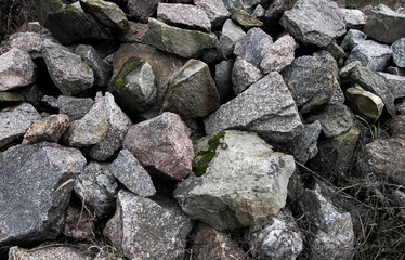 Mountain with stones. Granite building material for wall masonry.