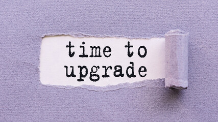 The text TIME TO UPGRADE appears on torn lilac paper against a white background.