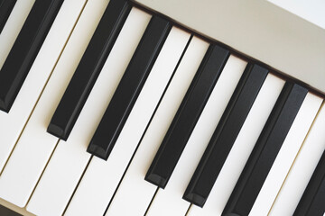 keys on a white piano close-up, piano composition, musical accompaniment and accompaniment, tinted image, selective focus