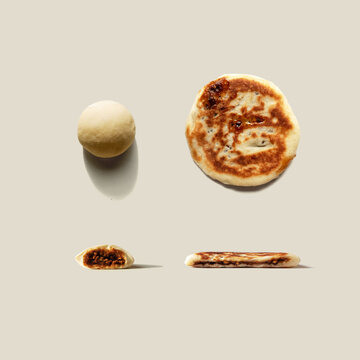 Hotteok on isoloated background. Sometimes called Hoeddeok, is a type of filled Korean pancake. It is a snack from Korean Chinese cuisine and is a popular street food in South Korea.