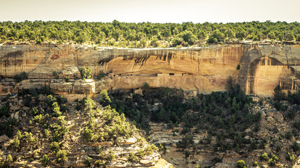Fototapeta na wymiar Panorama shot of canyon and ruins of historic rock towns in mesa verde national park in america