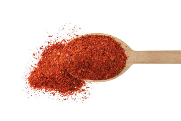 chilli pepper seedless flakes  in wooden spoon isolated on white background. Spices and food...