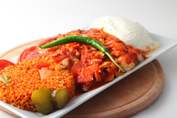 Turkish cuisine. Doner kebab meat with pommes frites potatoes and salad on plate isolated on white background