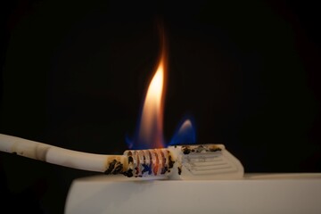 Burning plug socket with a flame
