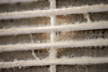 Dirty air ventilation grill of HVAC with clogged filter.