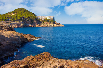 Fototapeta na wymiar View of Cap Sa Sal from the other end of the Aiguafreda cove, which can be accessed through a coastal path that borders the cove. Begur, Costa Brava, Catalonia, Spain