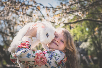 child with white rabbit, friends forever