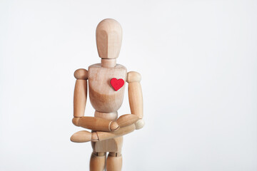 wooden mannequin with a heart