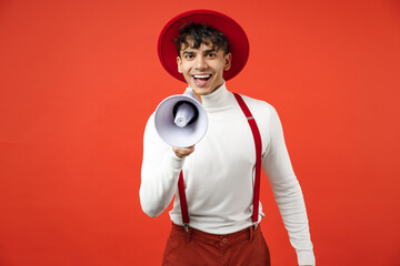 Young spanish latinos smiling happy stylish man 20s in casual hat white shirt trousers with...