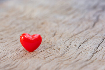 Fototapeta premium Valentines Day background with red hearts on plank wooden, copy space..