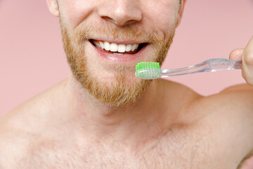 Cropped image of cheerful bearded naked young man 20s years old perfect skin hold toothbrush...