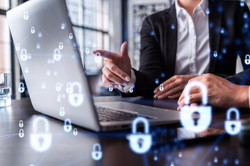 Two business people working on the project to protect cyber security of international company using...