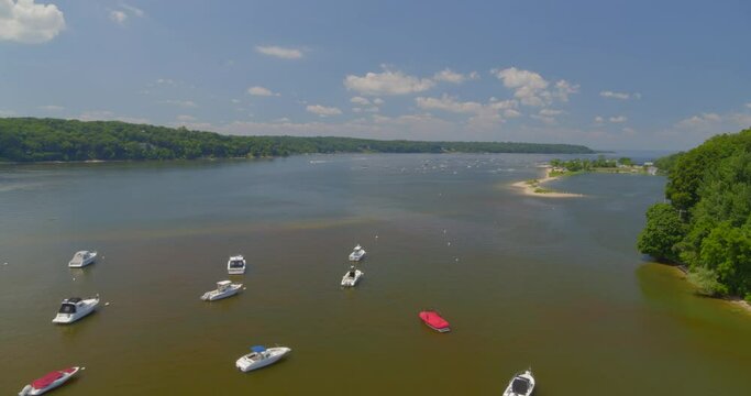 Flying Over Anchored Boats on Harbor Near a Forest on a Sunny Day