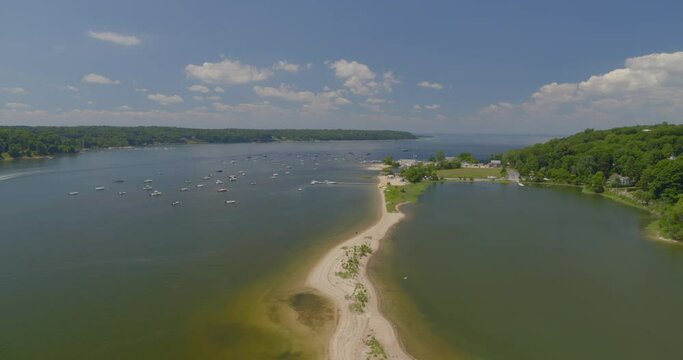Flying Towards Cold Spring Beach and Boats Anchored on Harbor in Long Island